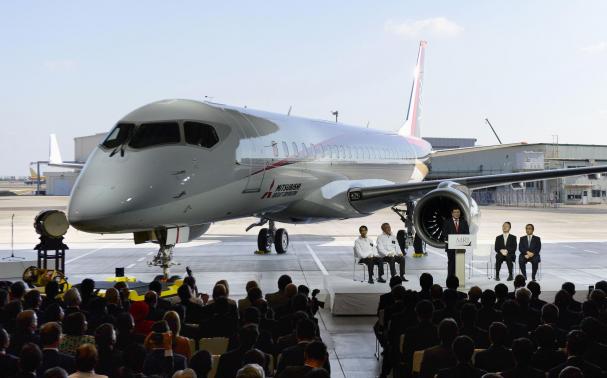 A Mitsubishi Regional Jet (MRJ) is unveiled at the hanger at Mitsubishi Heavy Industries' Nagoya Aerospace Systems Works Komaki Minami Plant in Toyoyama town, Nagoya prefecture